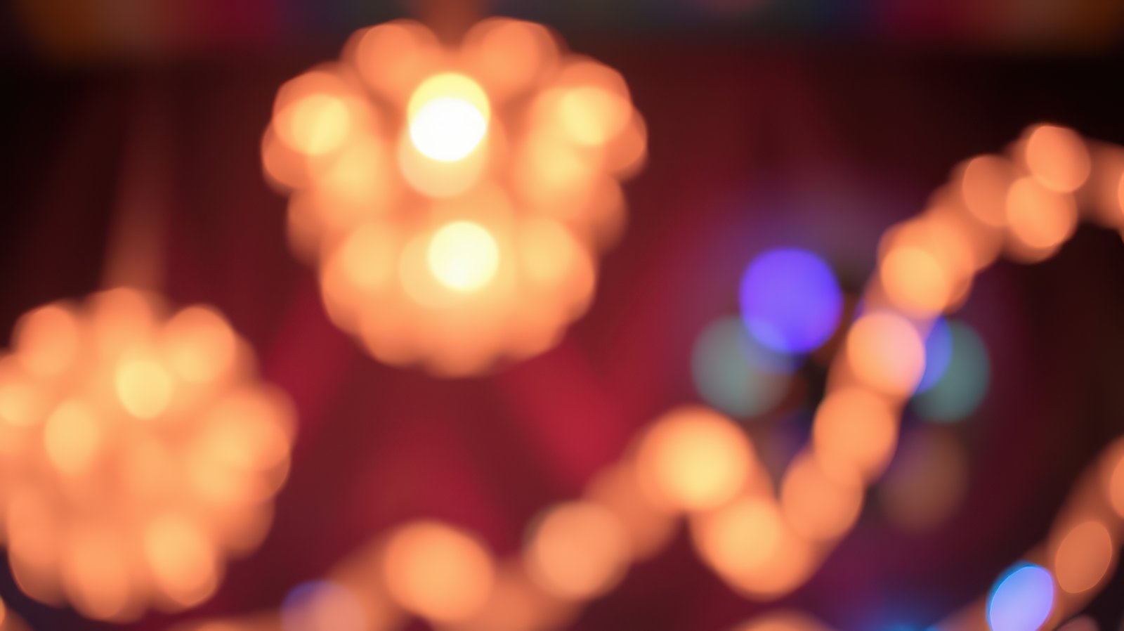 Ethereal warm lights create a cozy atmosphere in a festive indoor setting during evening hours
